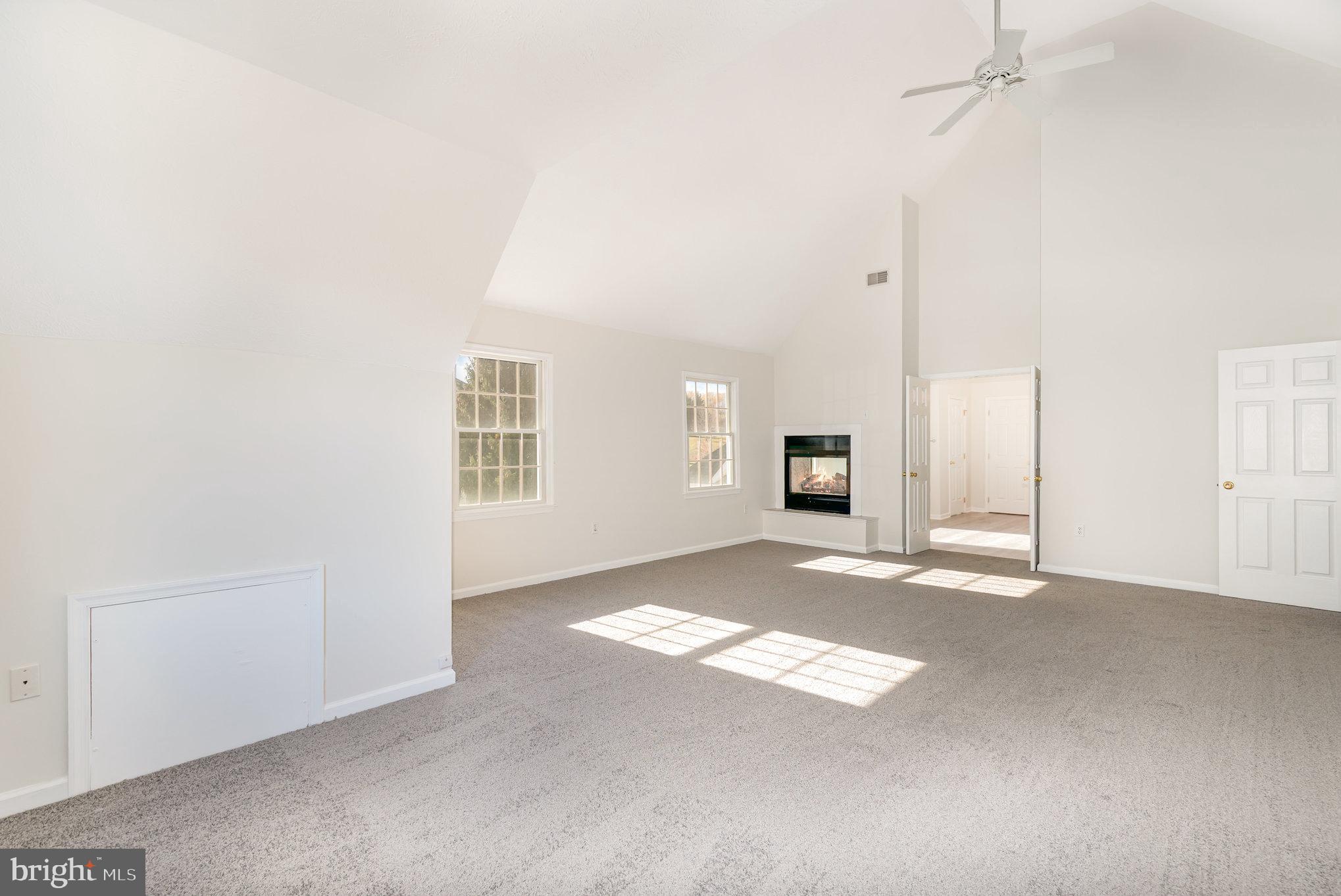 535 Oldfield Point Road Elkton, MD 21921 - Photo 17 of 46 a view of an empty room with a fireplace