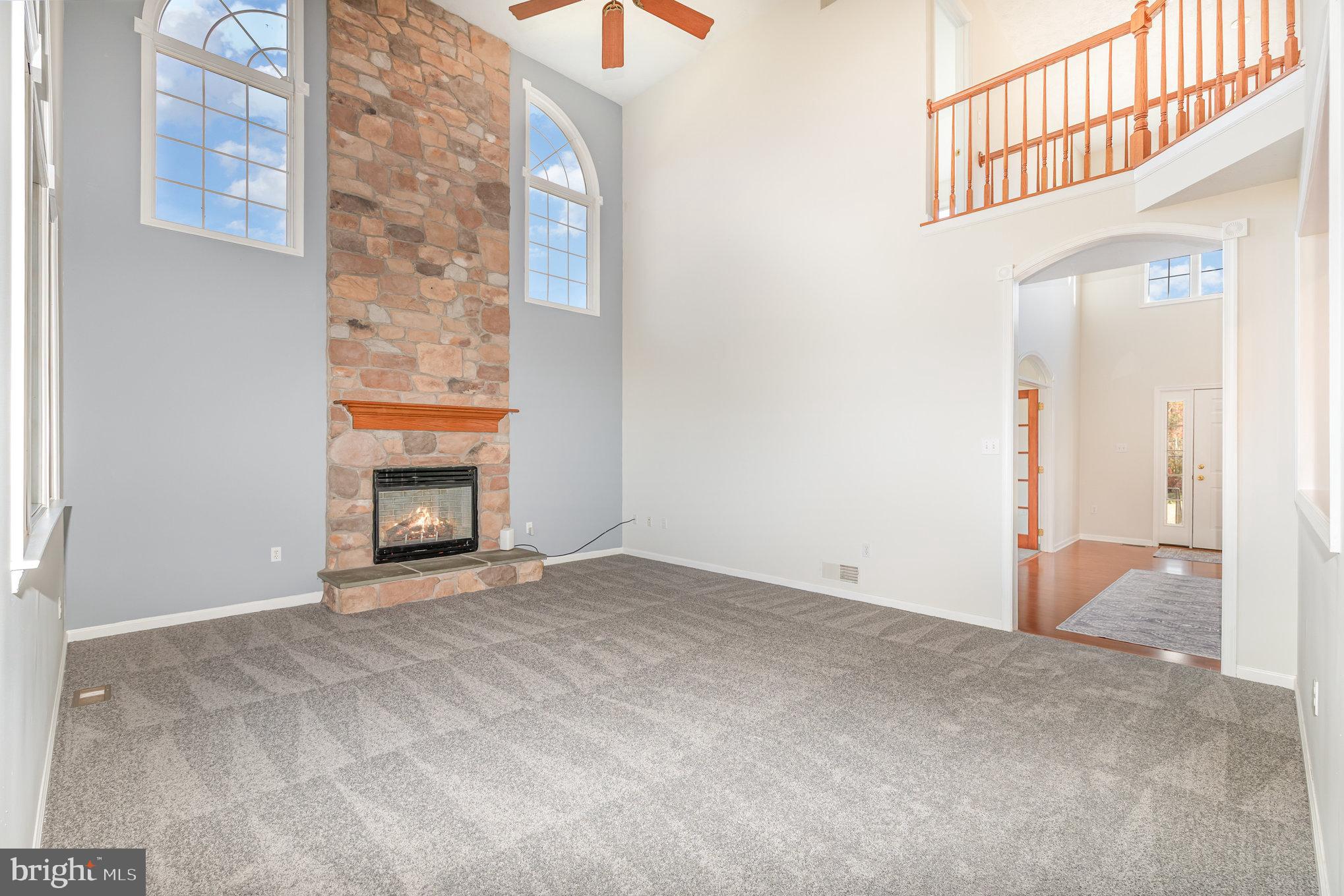 535 Oldfield Point Road Elkton, MD 21921 - Photo 4 of 46 a view of an empty room with a fireplace