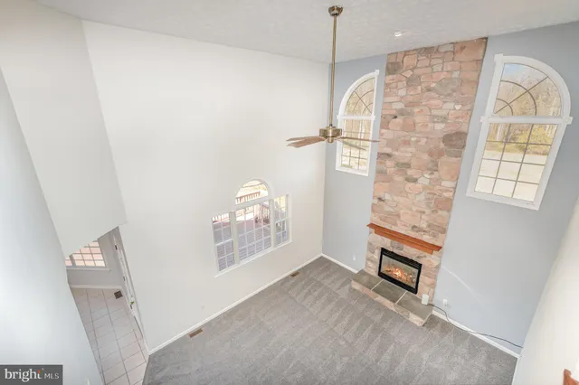 a view of empty room with windows