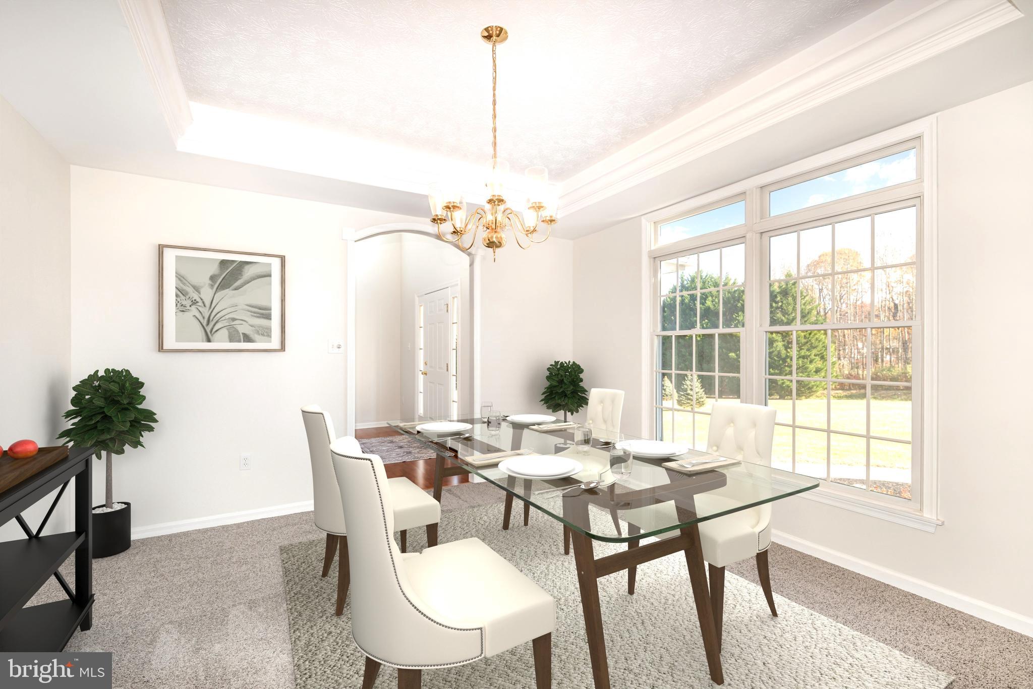 535 Oldfield Point Road Elkton, MD 21921 - Photo 6 of 46 a view of a dining room with furniture window and wooden floor