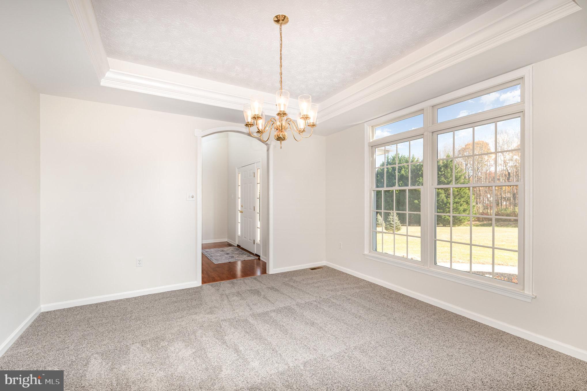 535 Oldfield Point Road Elkton, MD 21921 - Photo 7 of 46 a view of a livingroom with a chandelier fan and window