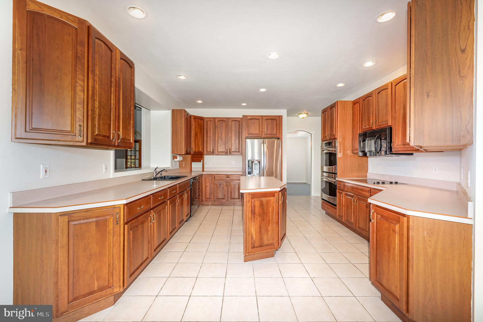 535 Oldfield Point Road Elkton, MD 21921 - Photo 8 of 46 a large kitchen with stainless steel appliances lots of counter top space