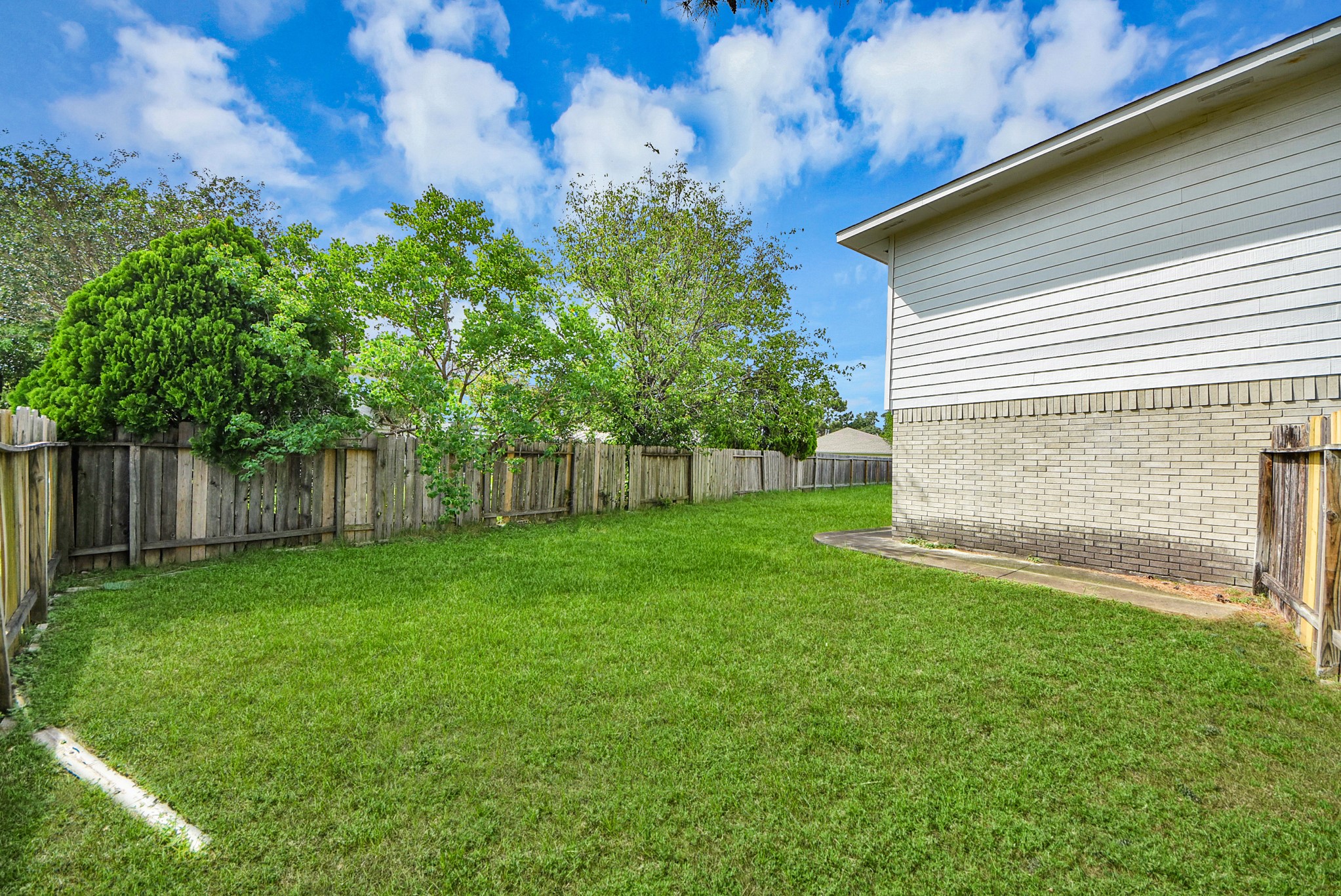 10003 Dakota Ridge Court Houston, TX 77095 - Photo 29 of 30 a view of a backyard with a small cabin