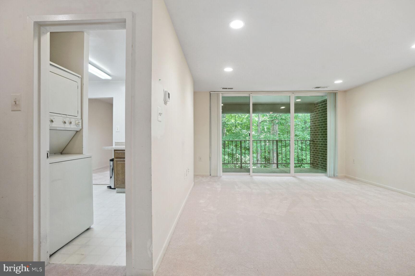 1546 Northgate Square, Unit 154622B Reston, VA 20190 - Photo 22 of 25 View of living room, kitchen, laundry