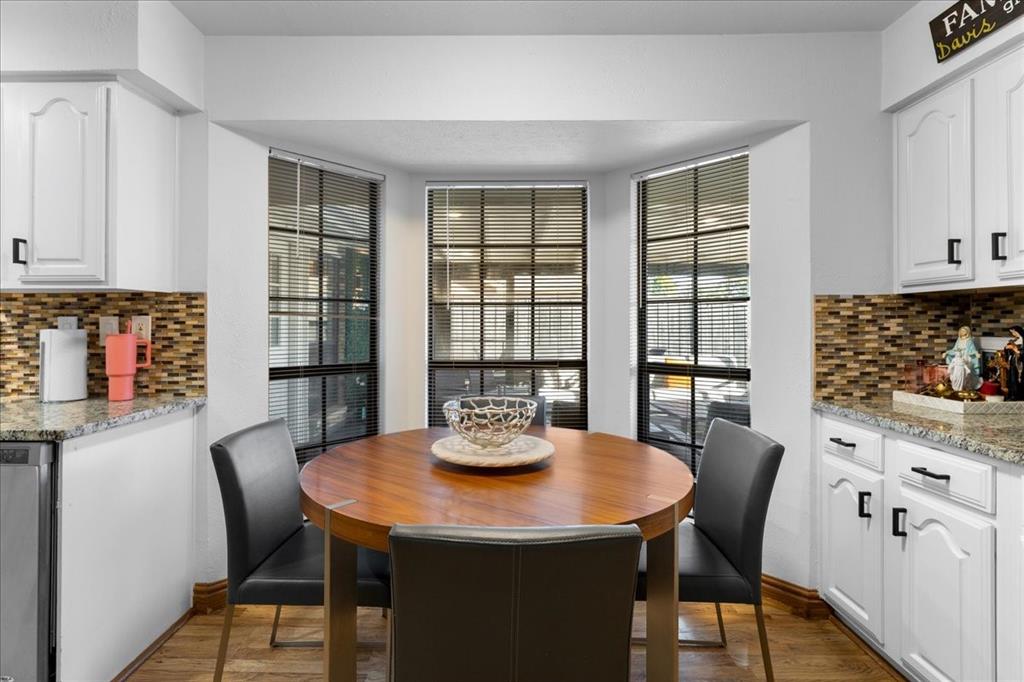 1208 Kesser Drive Plano, TX 75025 - Photo 14 of 33 Dining room with dark wood-style flooring
