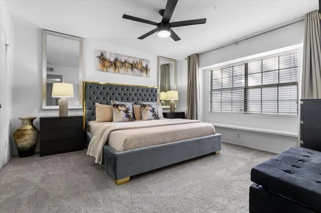 a bedroom with a bed and a couch