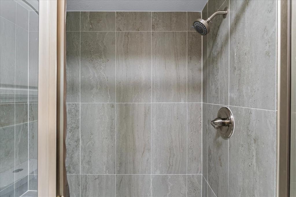 1208 Kesser Drive Plano, TX 75025 - Photo 21 of 33 Bathroom view of a tile shower