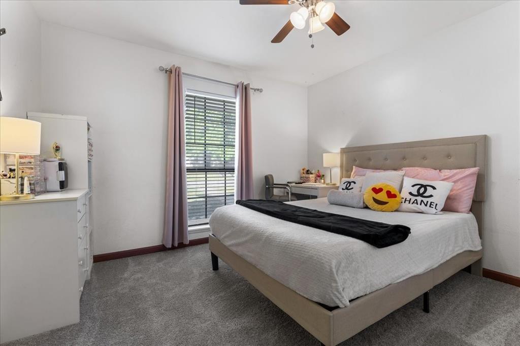 1208 Kesser Drive Plano, TX 75025 - Photo 24 of 33 Bedroom with dark carpet and a ceiling fan