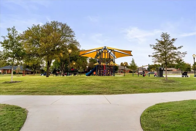 a view of a park with large trees