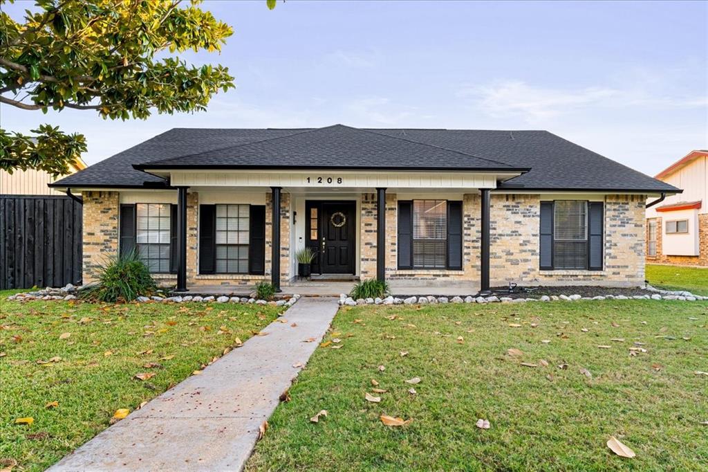 1208 Kesser Drive Plano, TX 75025 - Photo 4 of 33 Bungalow-style house with covered porch, roof with shingles, and brick siding