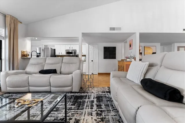 a living room with furniture and a rug