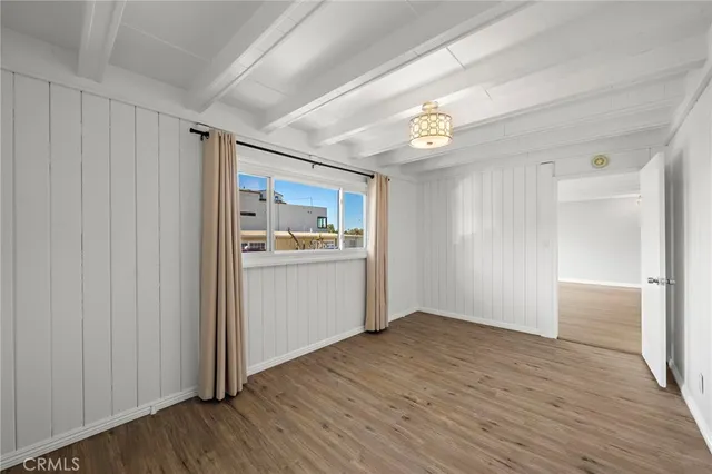 a view of a kitchen with a sink and a refrigerator