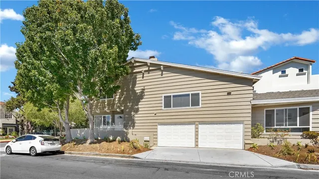 a view of a parked cars in front of house