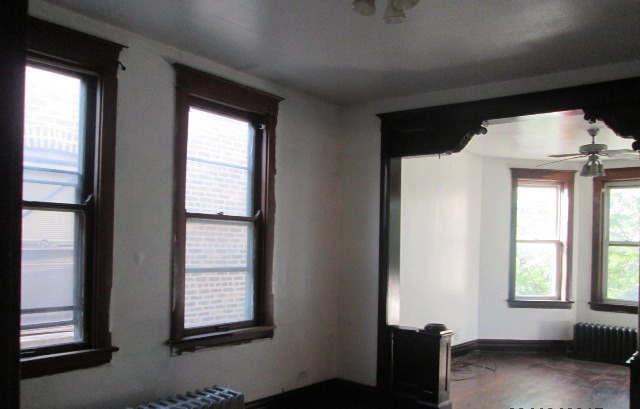 4132 West Cermak Road Chicago, IL 60623 - Photo 12 of 13 a view of an empty room with a window