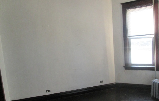 4132 West Cermak Road Chicago, IL 60623 - Photo 7 of 13 an empty room with a window