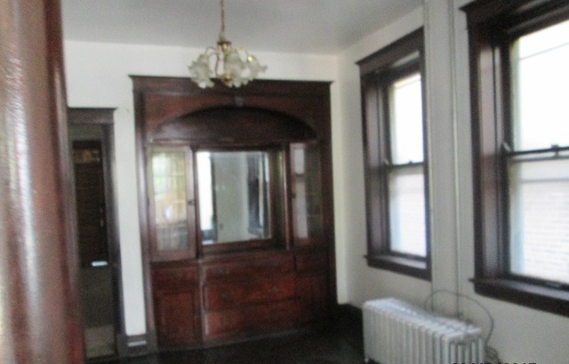 4132 West Cermak Road Chicago, IL 60623 - Photo 8 of 13 a view of a hallway with windows and chandelier
