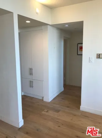an empty room with wooden floor