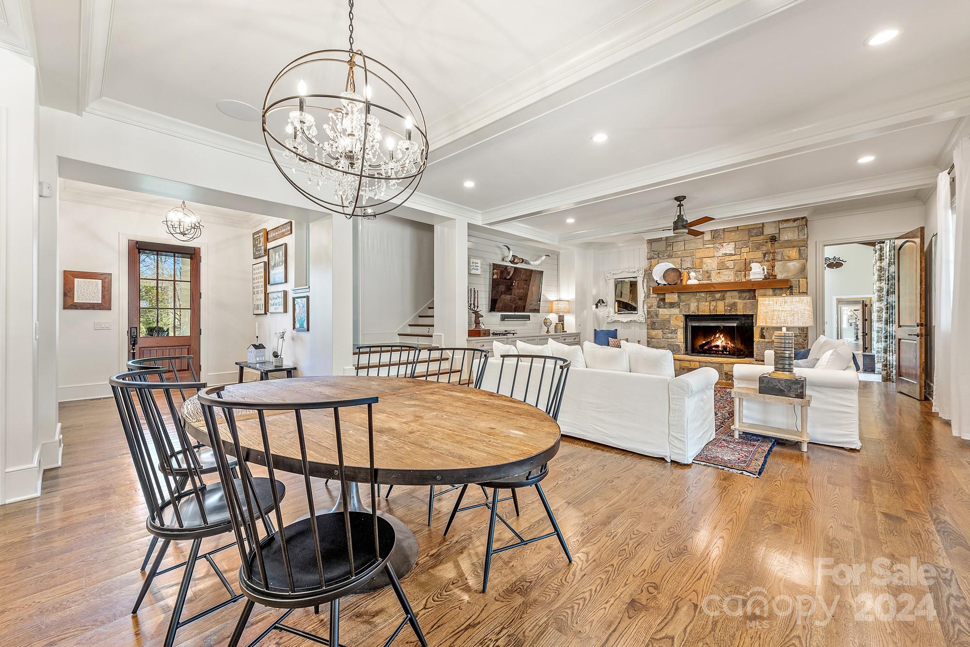 165 Timberside Drive Davidson, NC 28036 - Photo 12 of 48 a view of a dining room with furniture wooden floor and chandelier