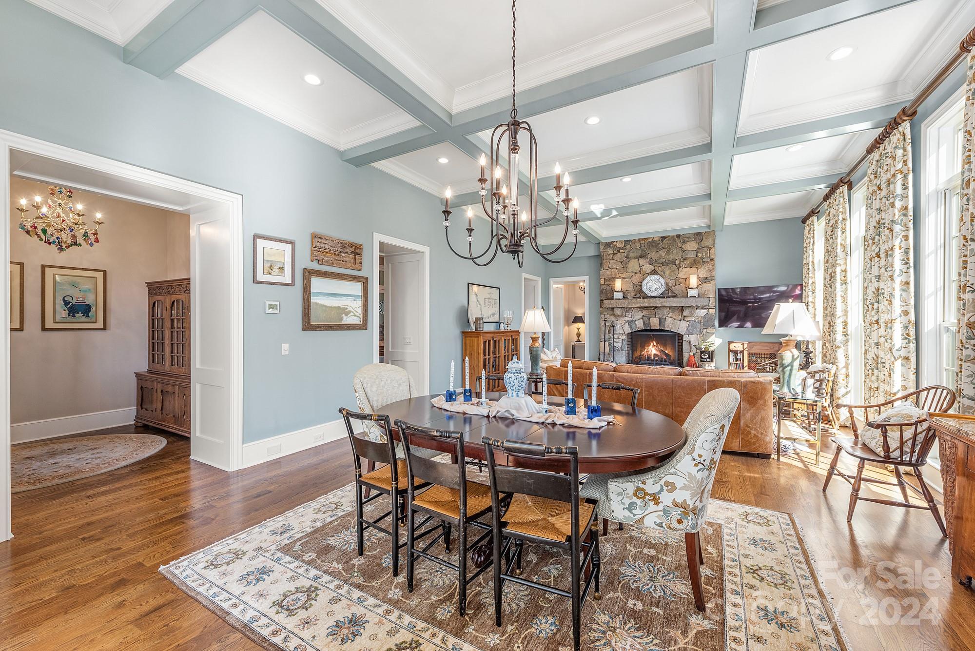 165 Timberside Drive Davidson, NC 28036 - Photo 13 of 48 a view of a dining room with furniture wooden floor and chandelier