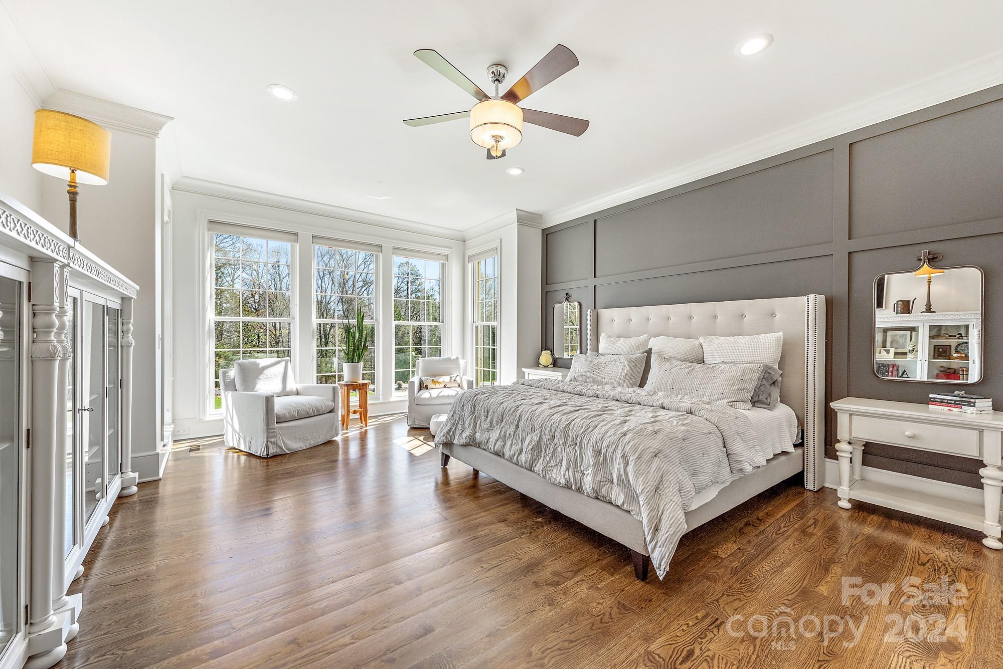 165 Timberside Drive Davidson, NC 28036 - Photo 14 of 48 a bedroom with a large bed and a large window