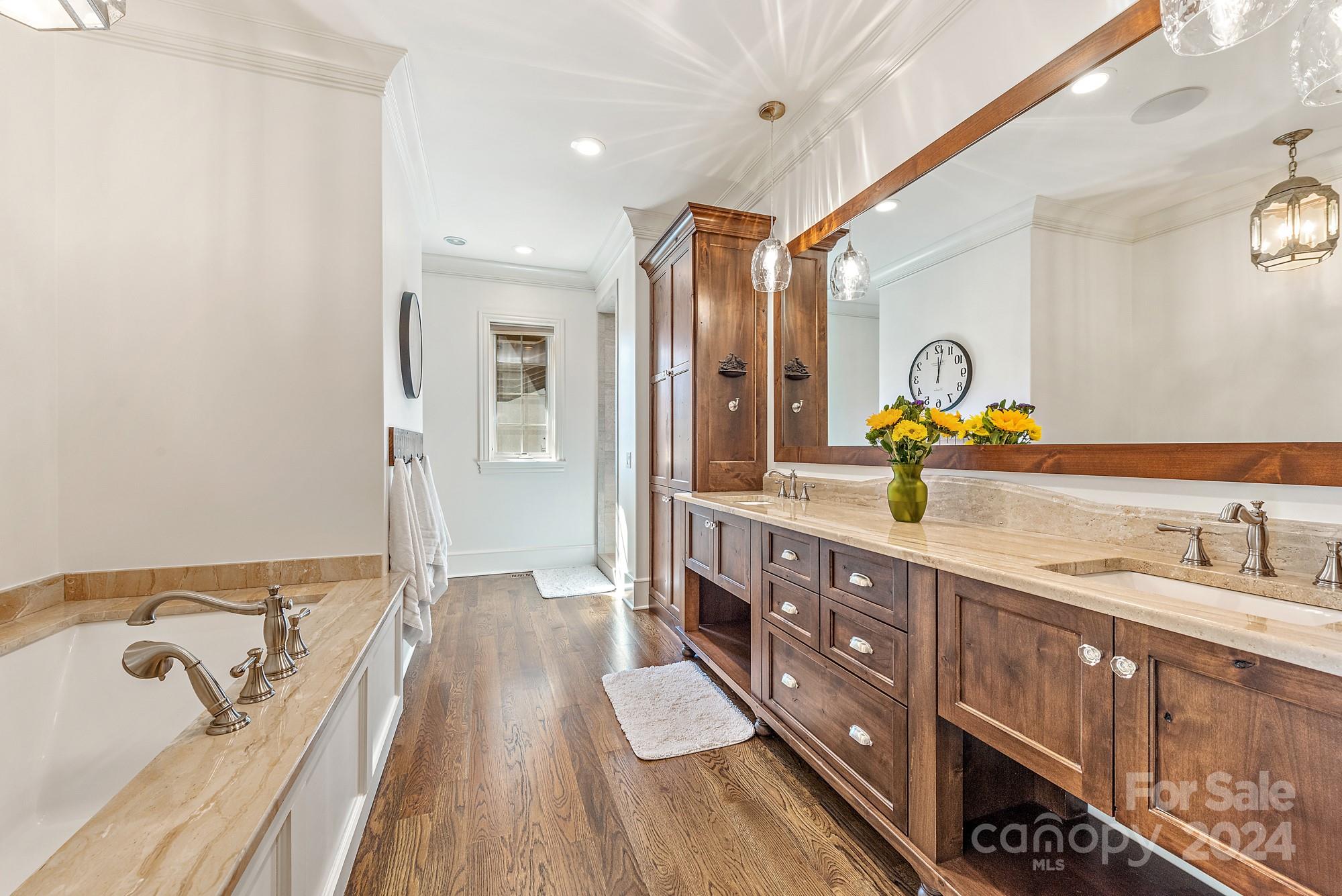 165 Timberside Drive Davidson, NC 28036 - Photo 15 of 48 a spacious bathroom with a double vanity sink and a mirror