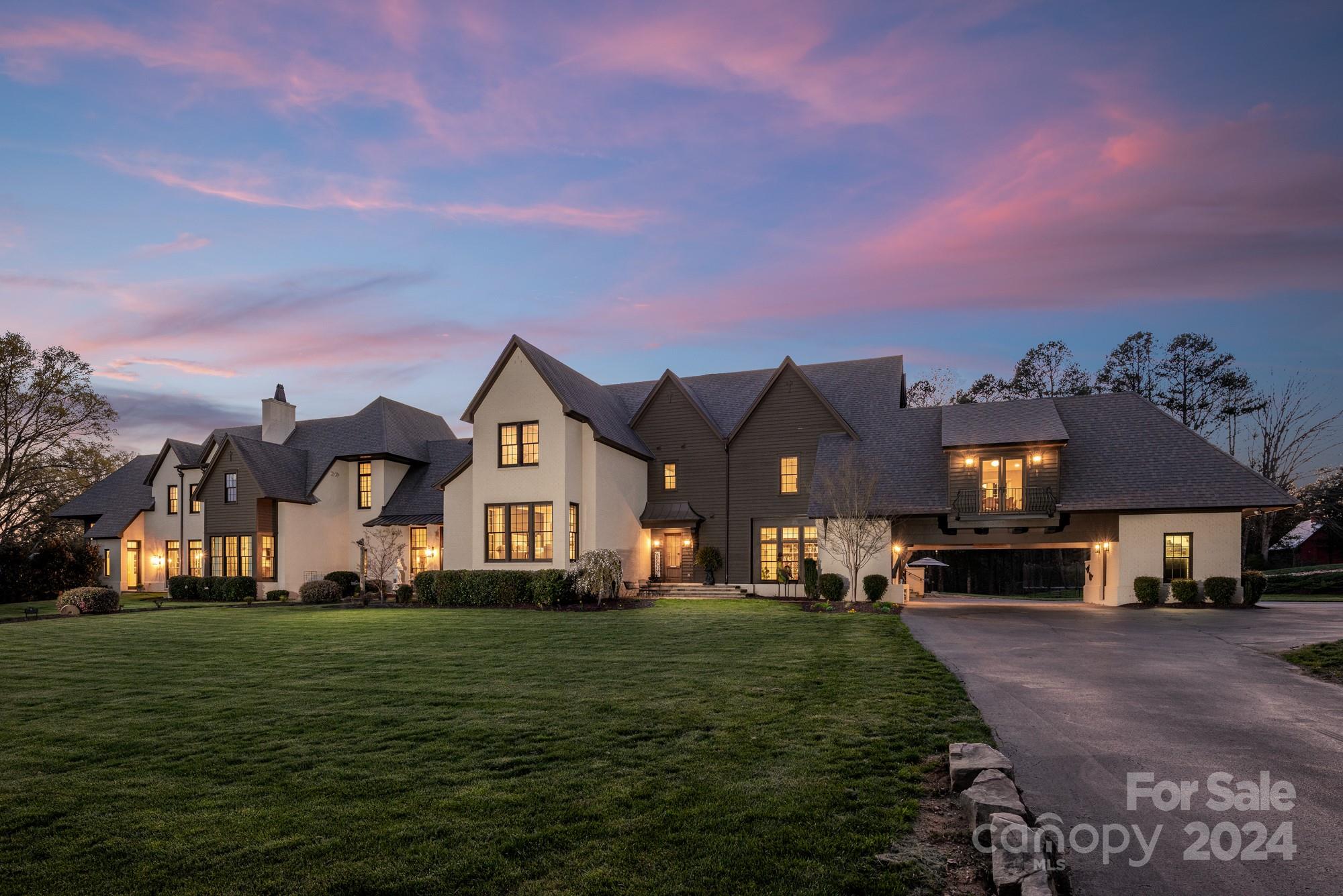 165 Timberside Drive Davidson, NC 28036 - Photo 2 of 48 a front view of a house with a garden and yard