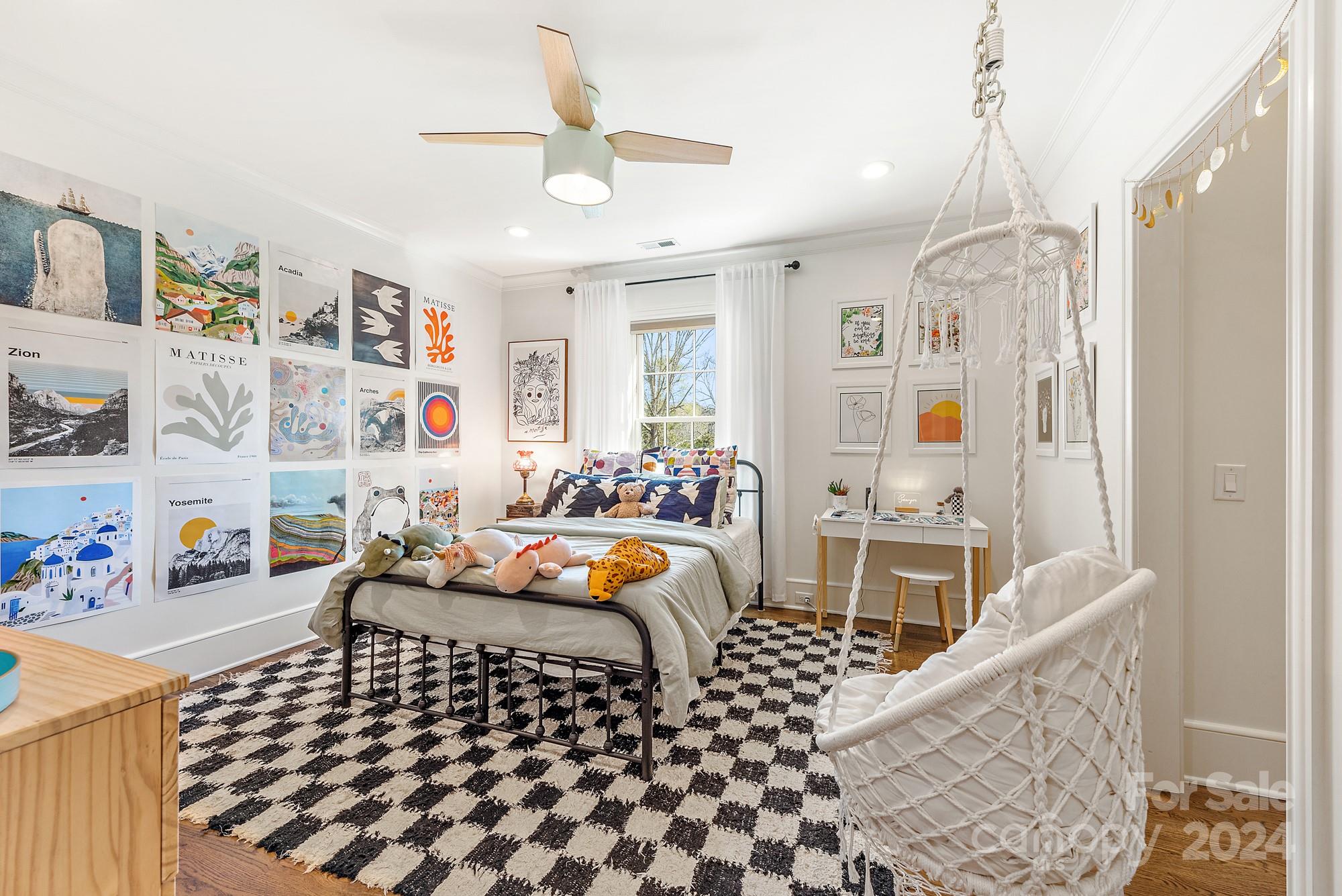 165 Timberside Drive Davidson, NC 28036 - Photo 22 of 48 a bedroom with furniture and a chandelier