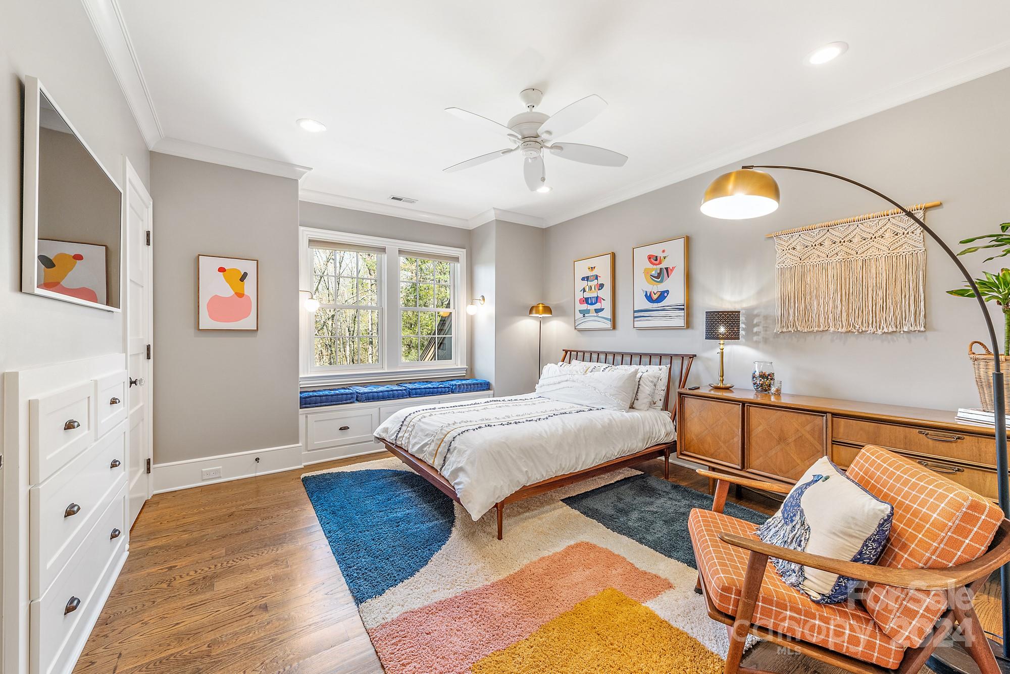 165 Timberside Drive Davidson, NC 28036 - Photo 24 of 48 a bedroom with a bed and wooden floor