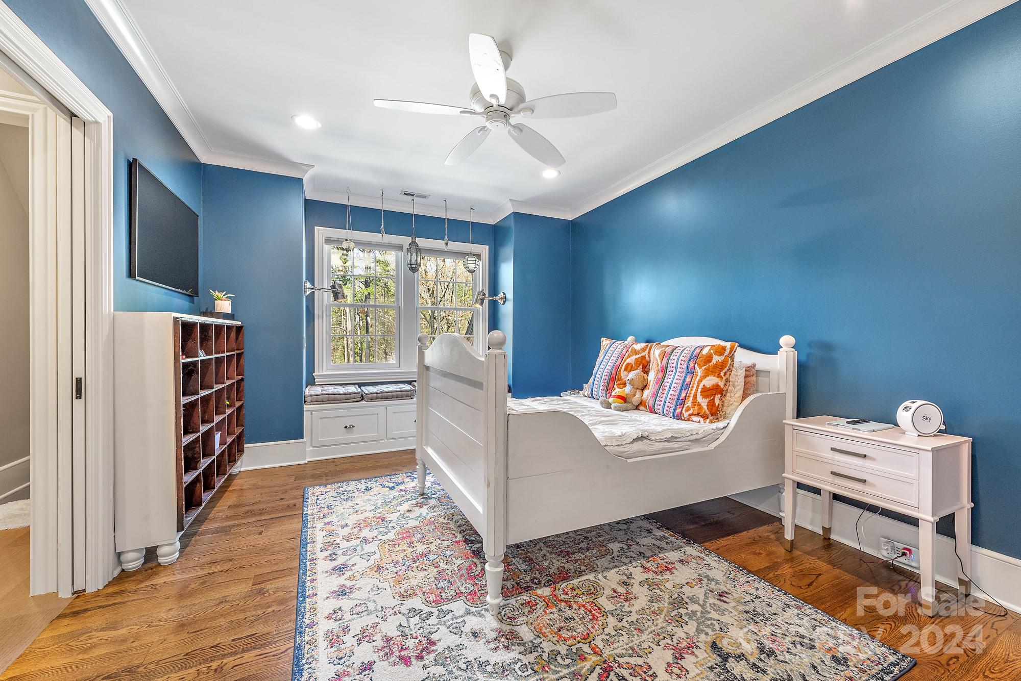 165 Timberside Drive Davidson, NC 28036 - Photo 25 of 48 a living room with furniture and a book shelf