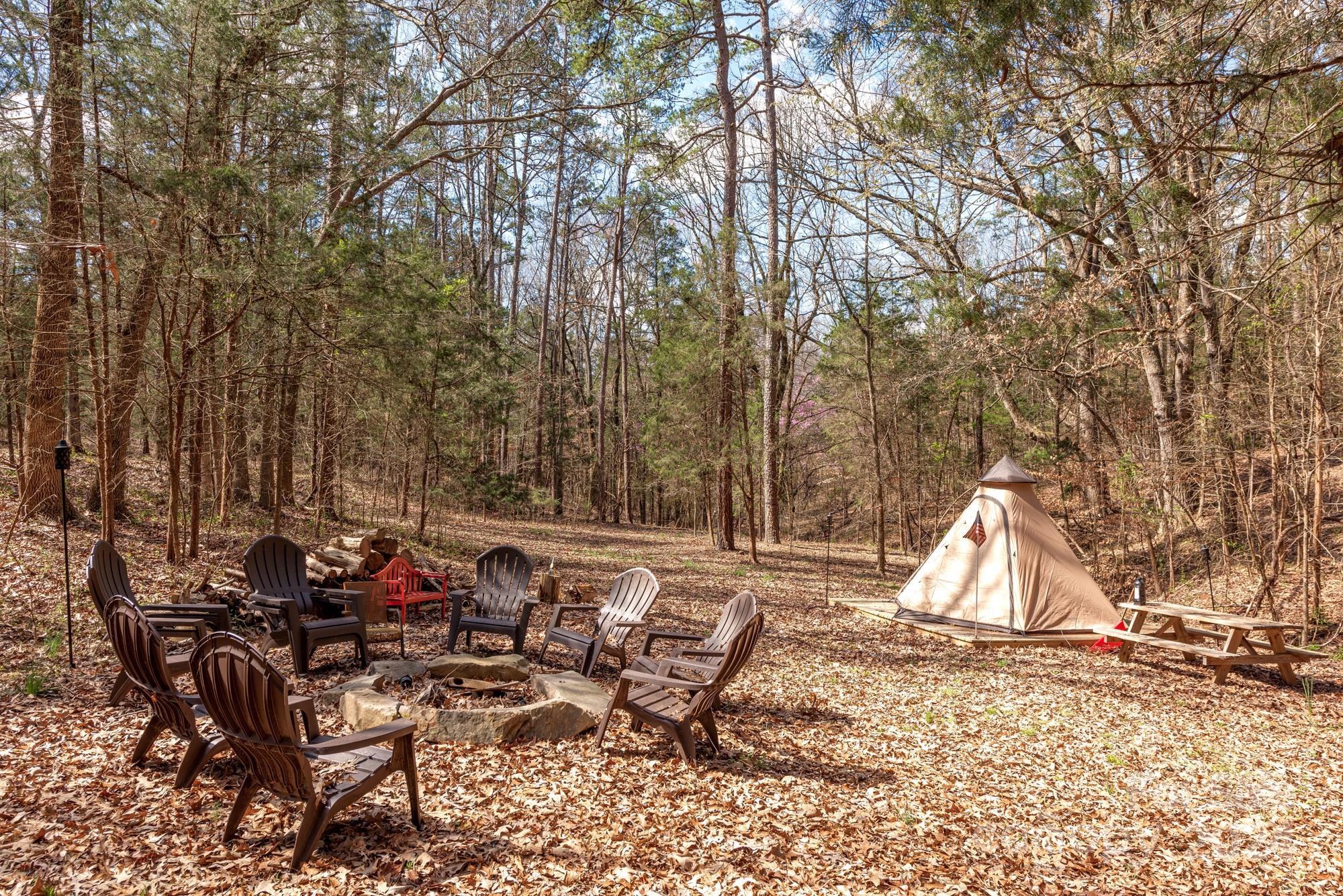 165 Timberside Drive Davidson, NC 28036 - Photo 33 of 48 a view of backyard with table and chairs and a large tree