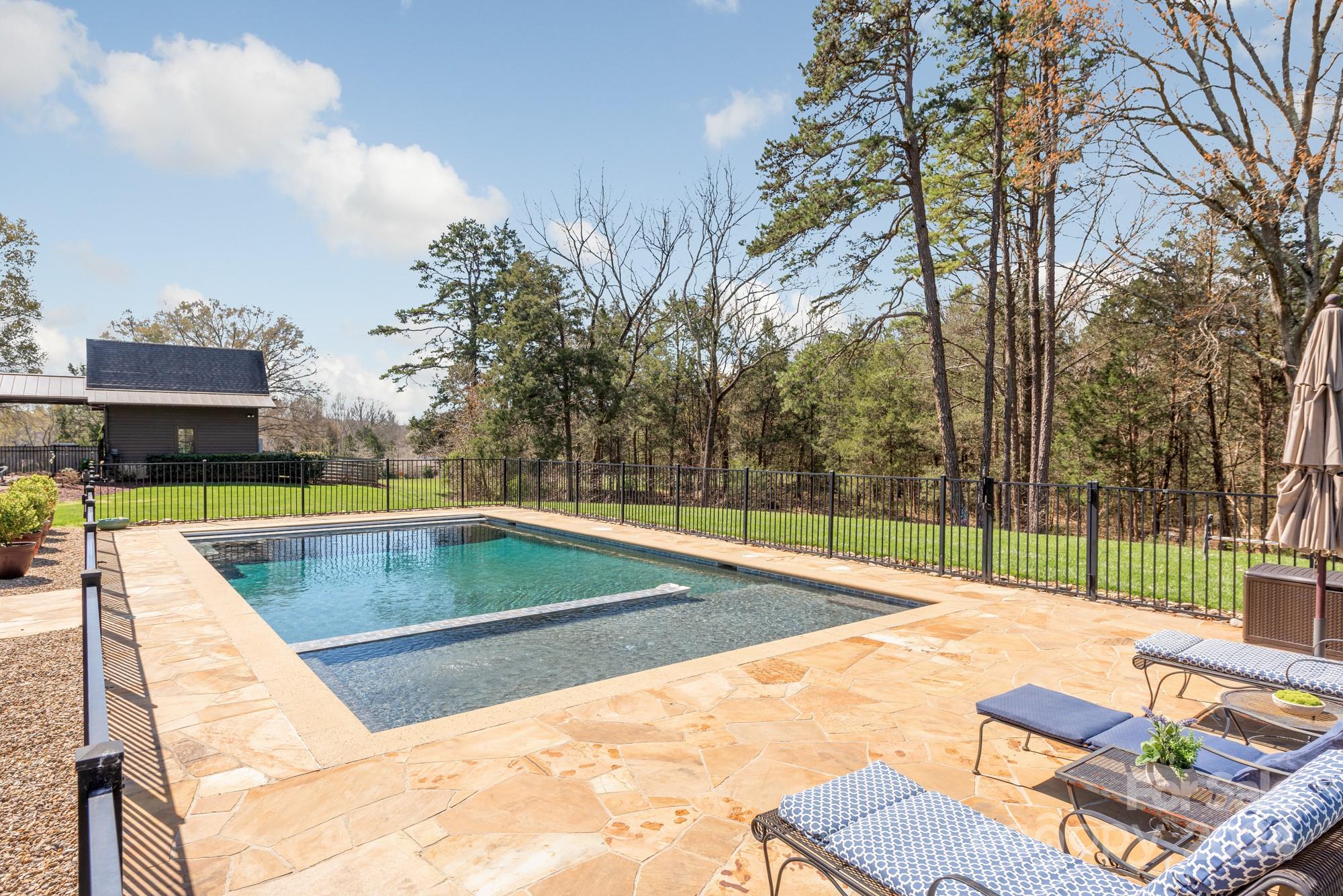 165 Timberside Drive Davidson, NC 28036 - Photo 34 of 48 a view of a swimming pool with a patio and a yard