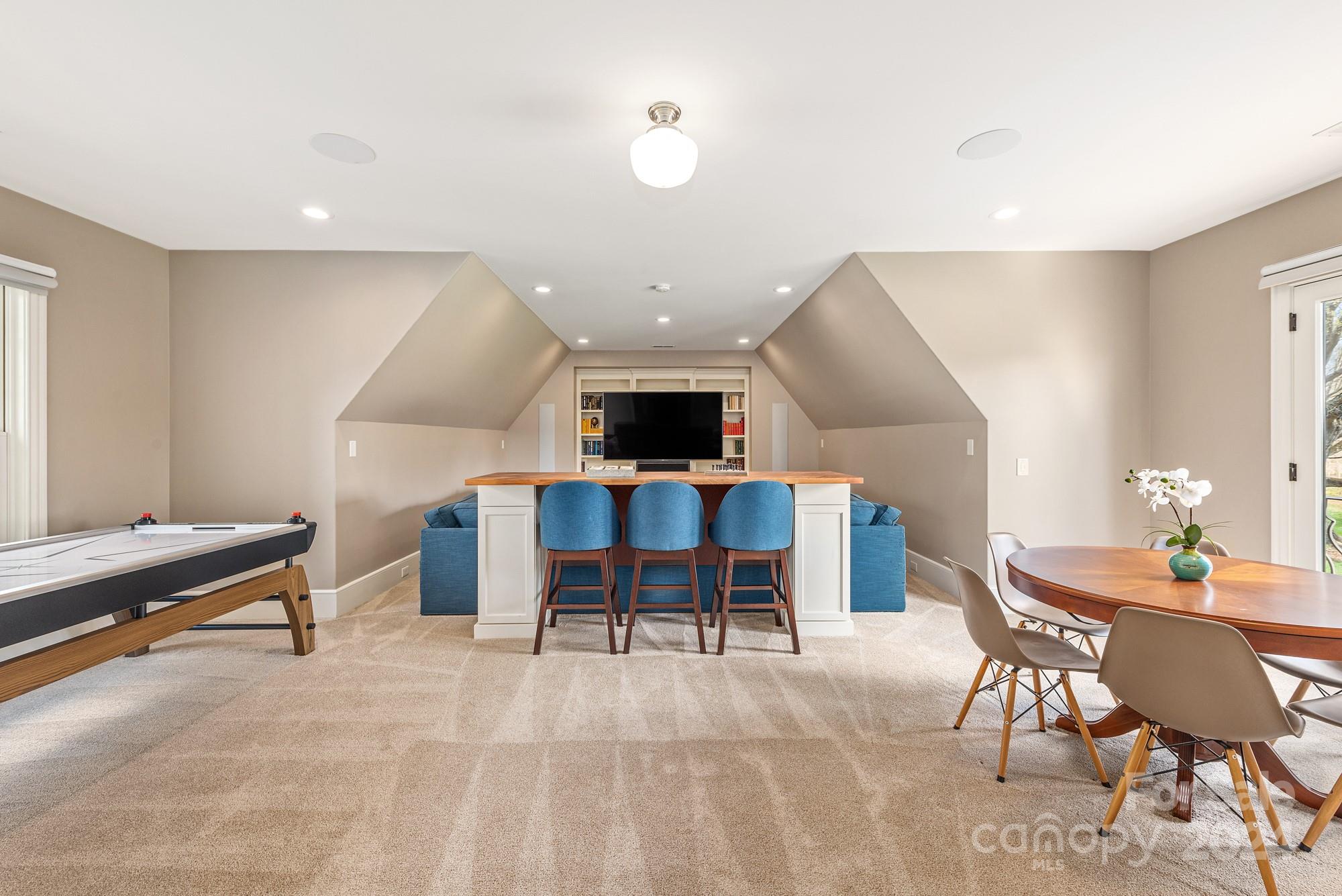 165 Timberside Drive Davidson, NC 28036 - Photo 35 of 48 a living room with furniture and a flat screen tv