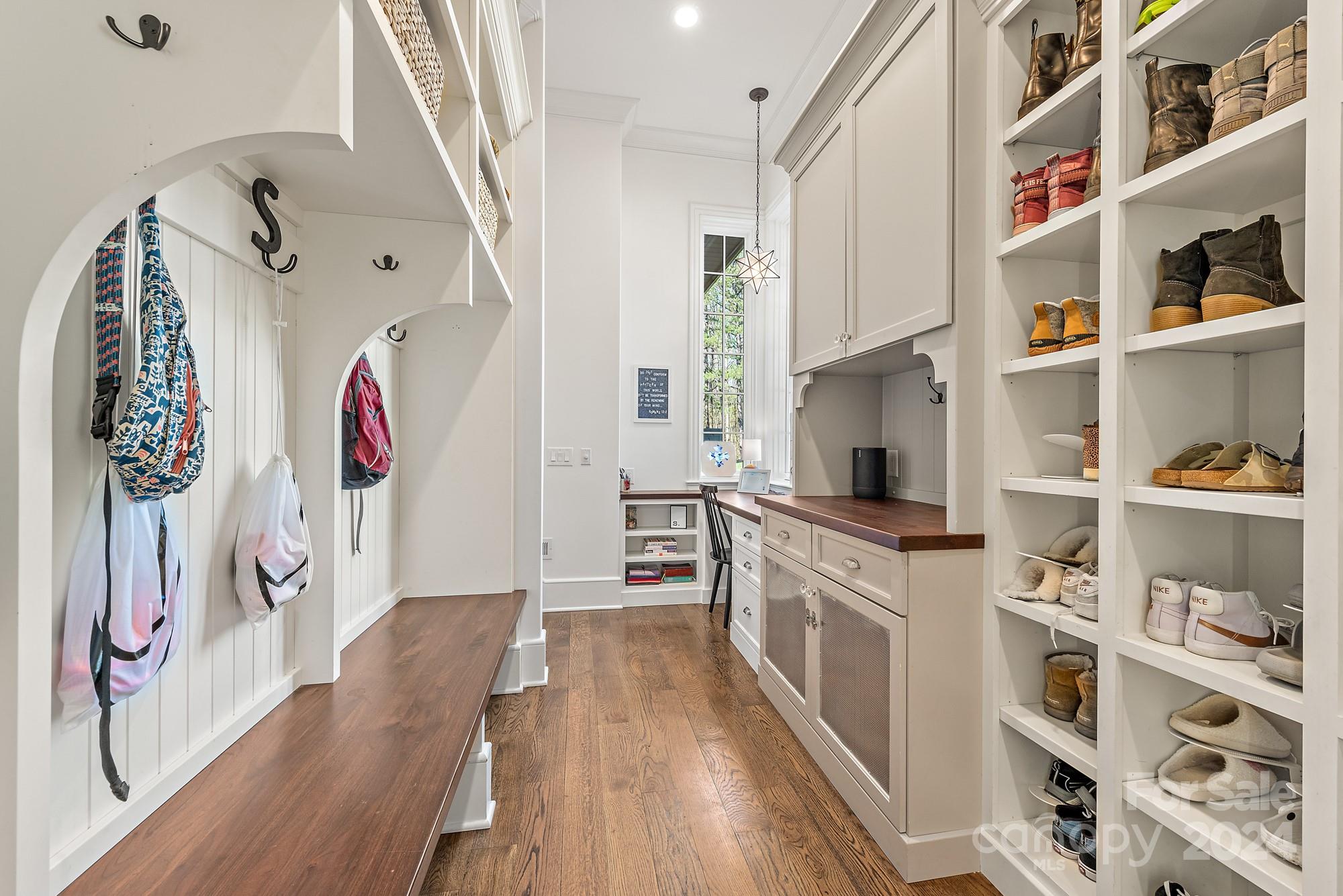 165 Timberside Drive Davidson, NC 28036 - Photo 39 of 48 a kitchen with stainless steel appliances granite countertop lots of white cabinets and wooden floor