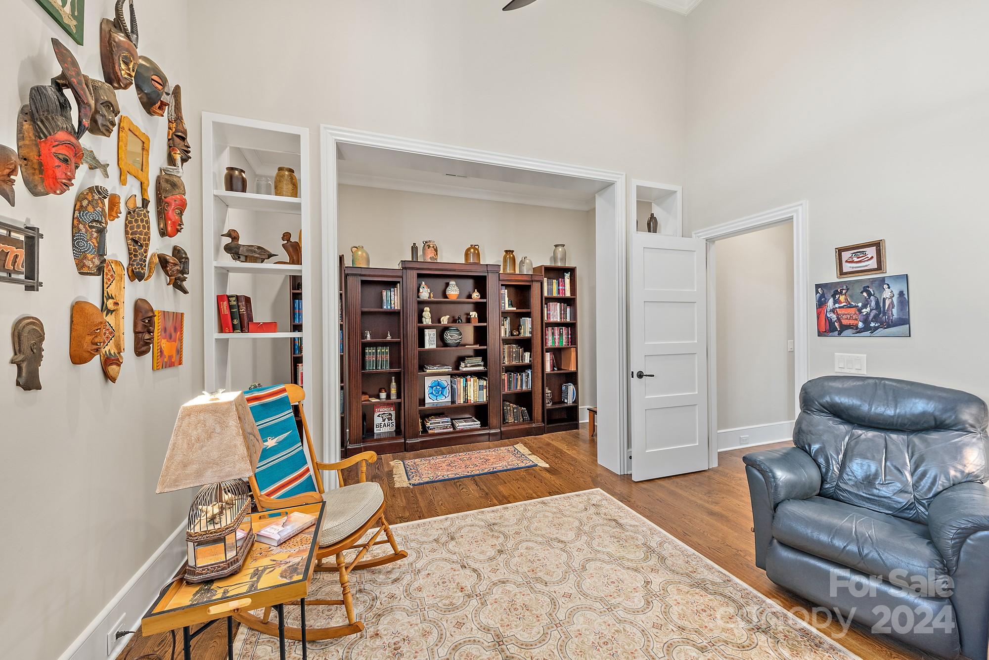 165 Timberside Drive Davidson, NC 28036 - Photo 40 of 48 a living room with furniture and book shelf