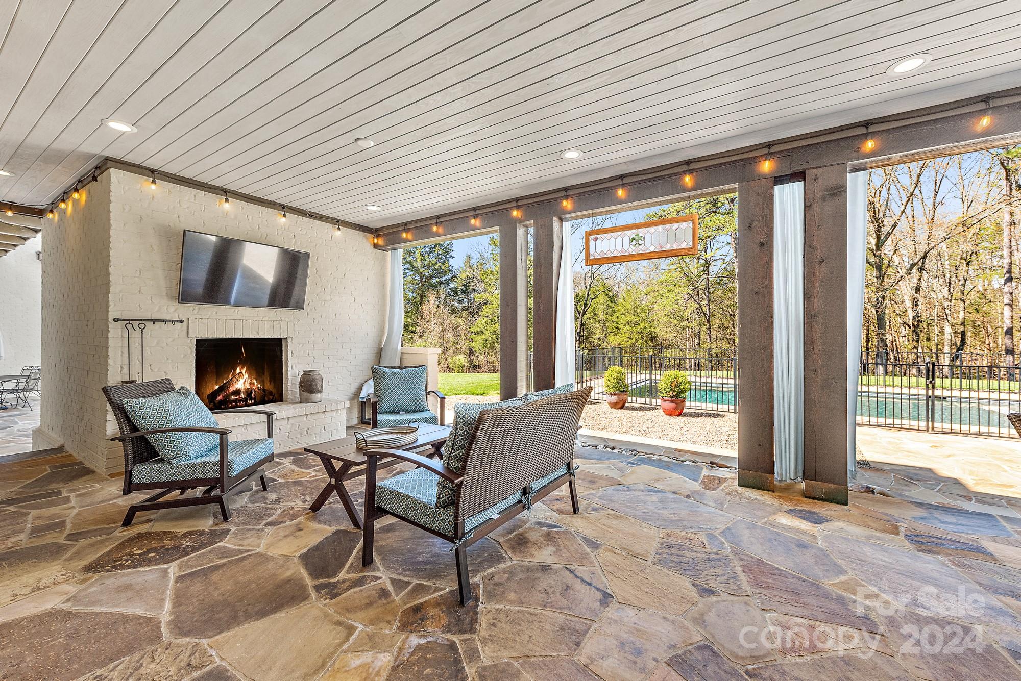 165 Timberside Drive Davidson, NC 28036 - Photo 4 of 48 a living room with furniture and a fireplace
