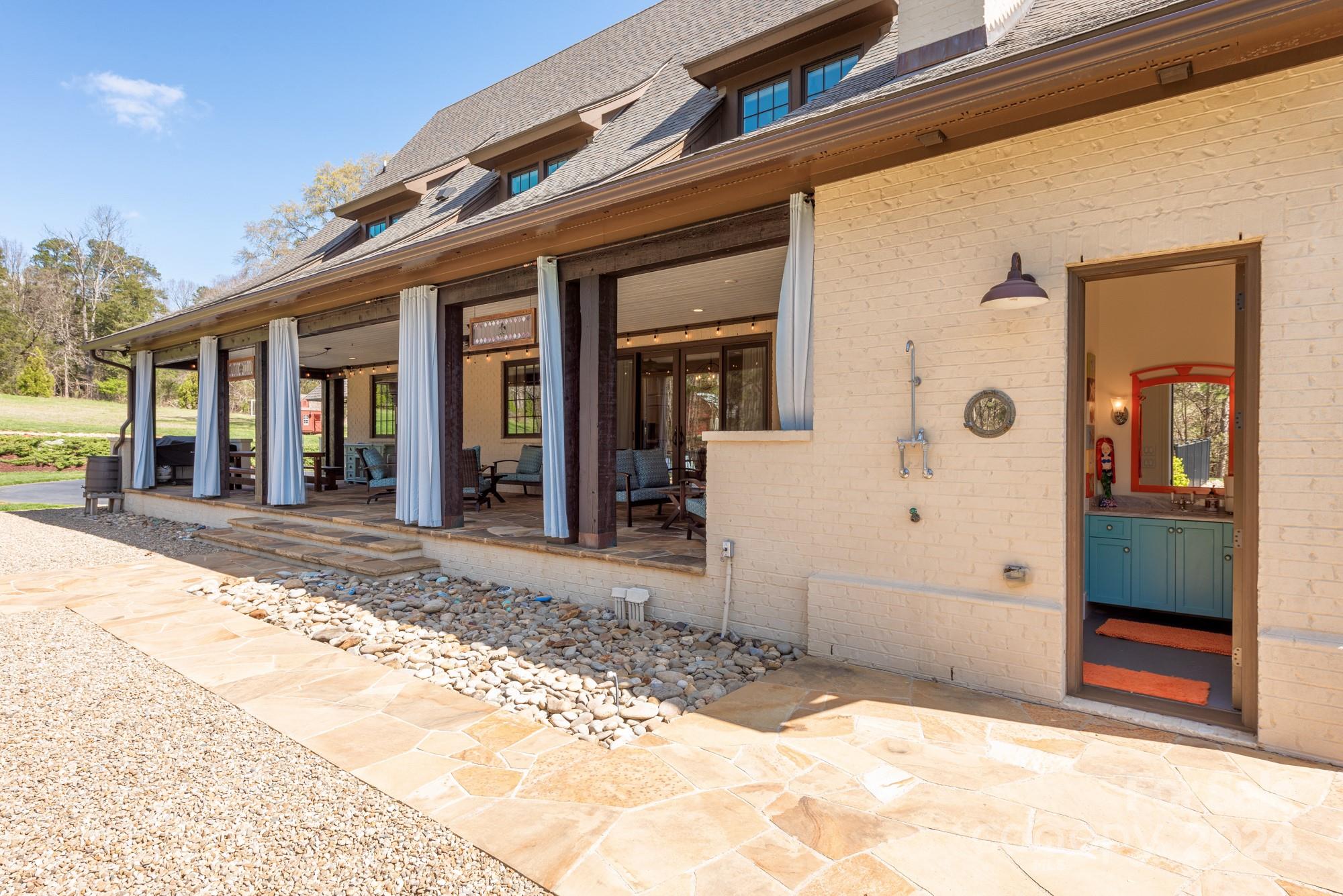 165 Timberside Drive Davidson, NC 28036 - Photo 45 of 48 a view of a house with a outdoor space porch