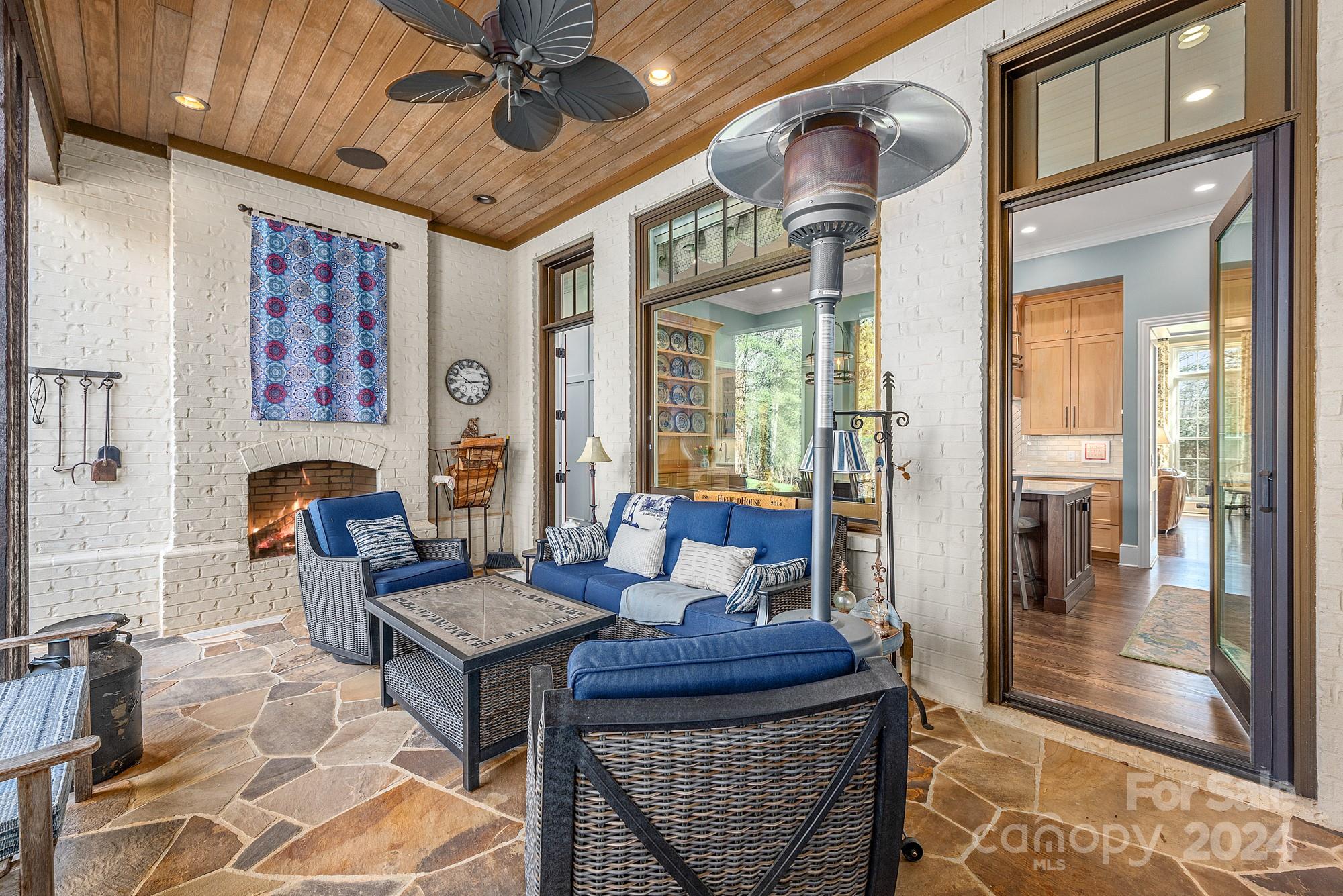 165 Timberside Drive Davidson, NC 28036 - Photo 5 of 48 a living room with furniture a rug and a chandelier
