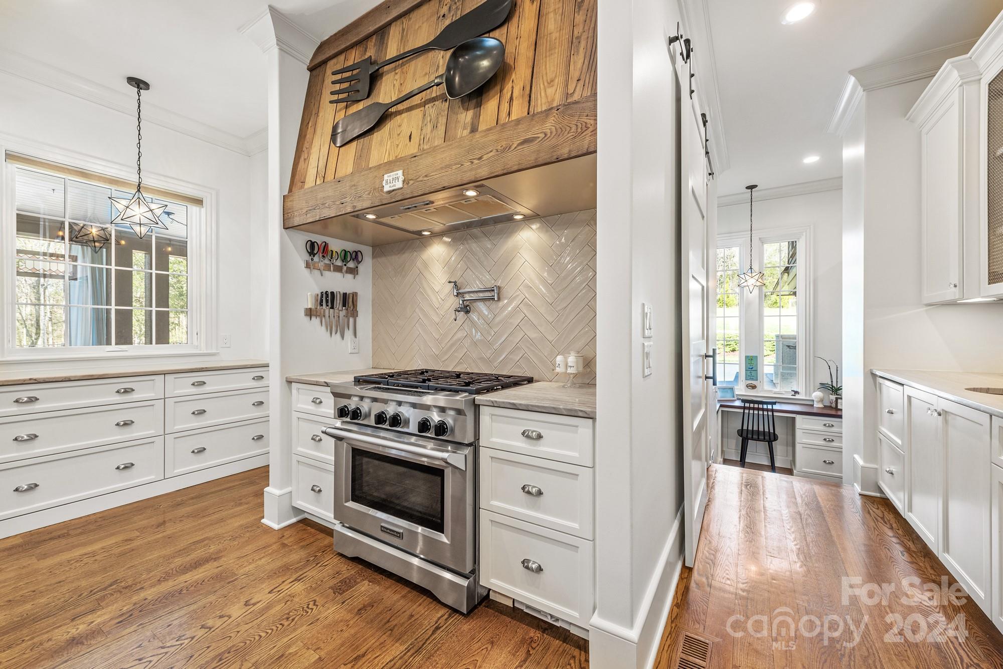 165 Timberside Drive Davidson, NC 28036 - Photo 8 of 48 a kitchen with stove and cabinets