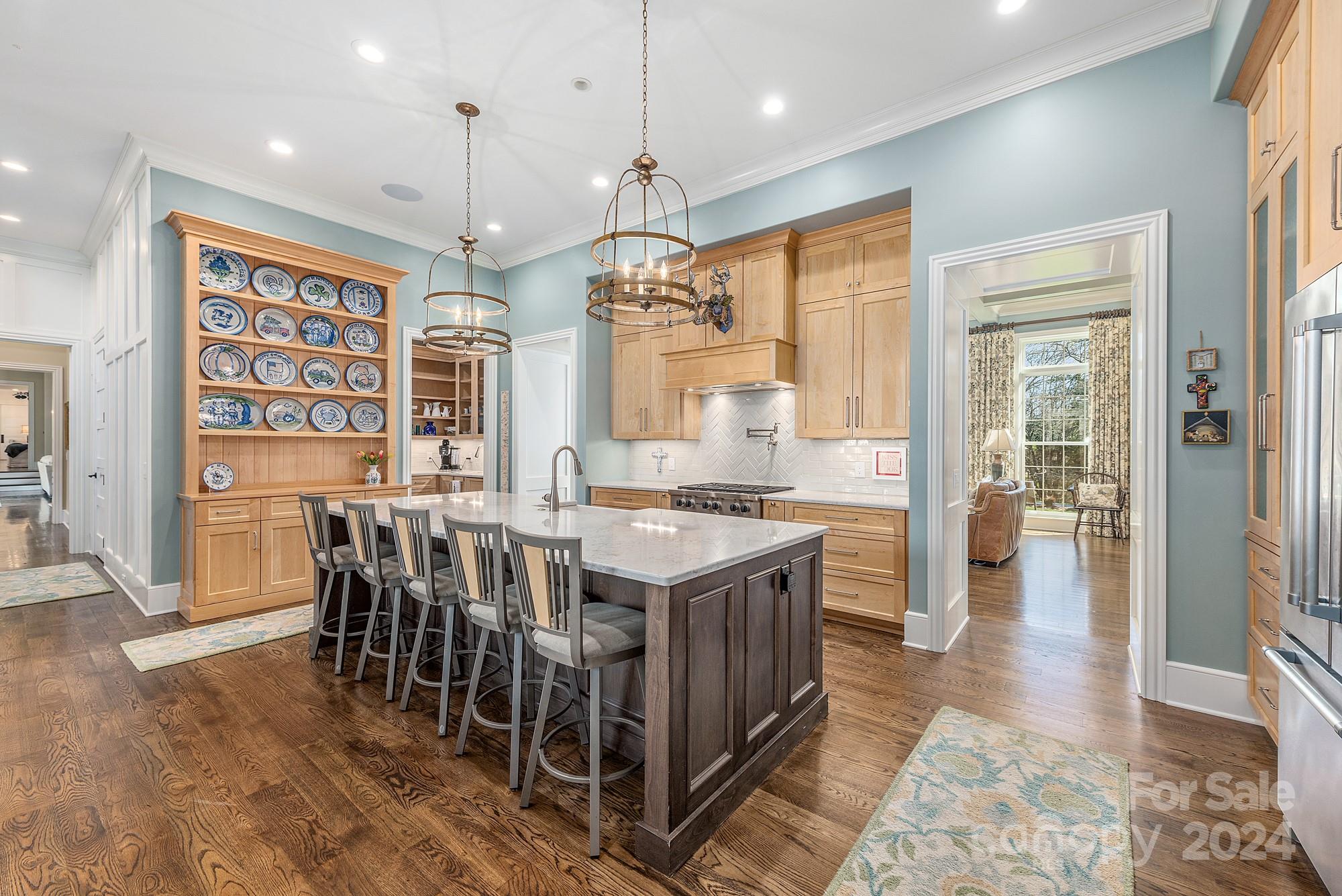 165 Timberside Drive Davidson, NC 28036 - Photo 9 of 48 a large kitchen with a table and chairs