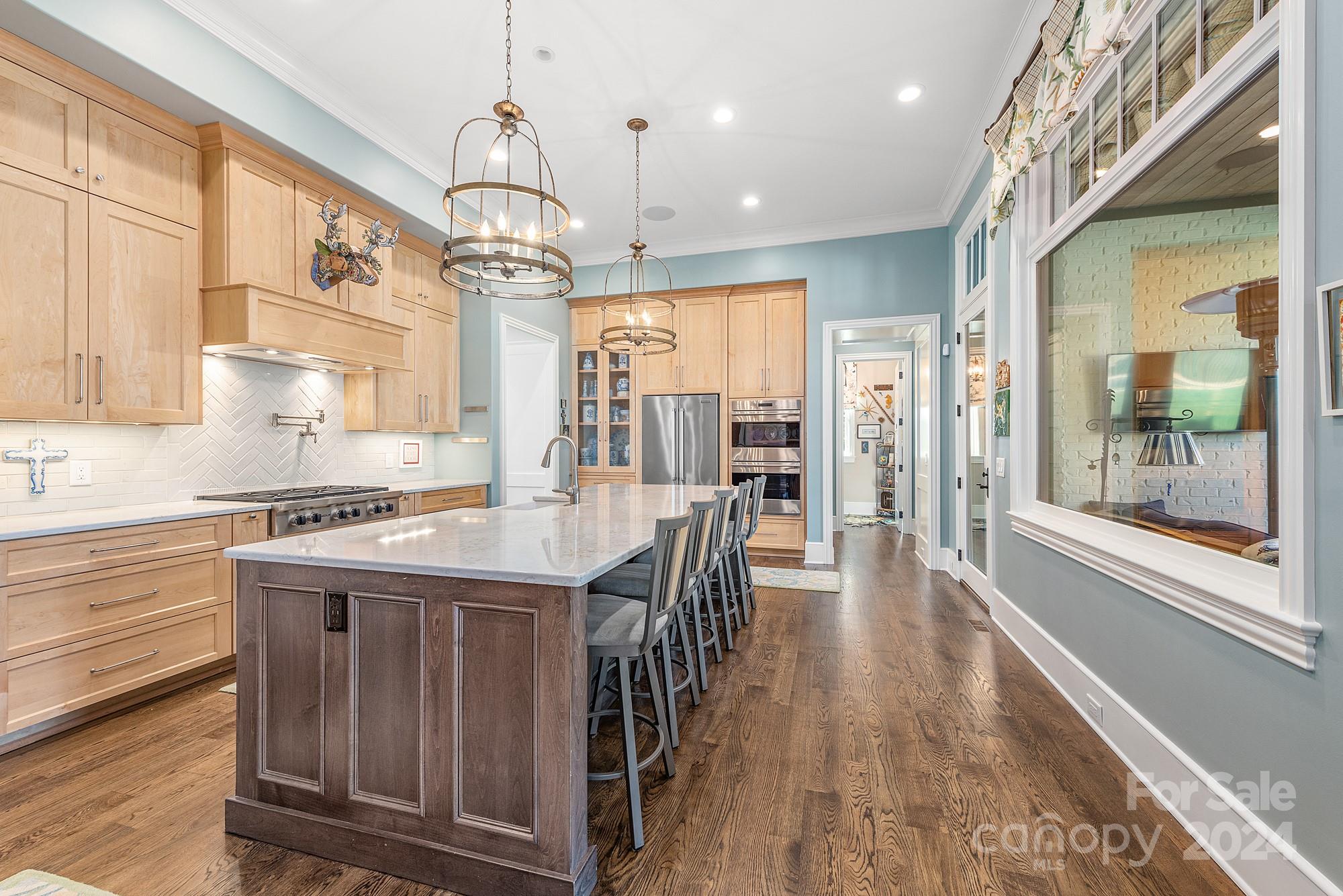 165 Timberside Drive Davidson, NC 28036 - Photo 10 of 48 a kitchen with stove and wooden floor