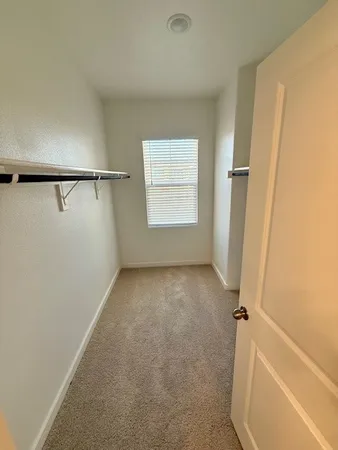 a front view of a house with large windows