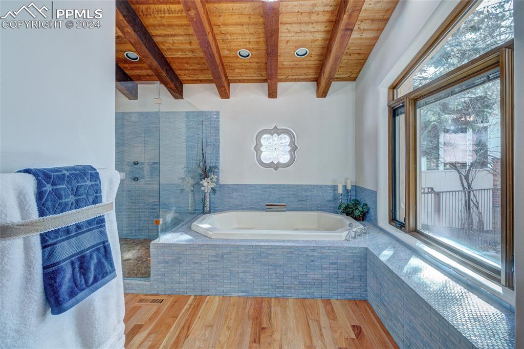 15 4th Street Colorado Springs, CO 80906 - Photo 32 of 46 a bathroom with a bathtub and a shower