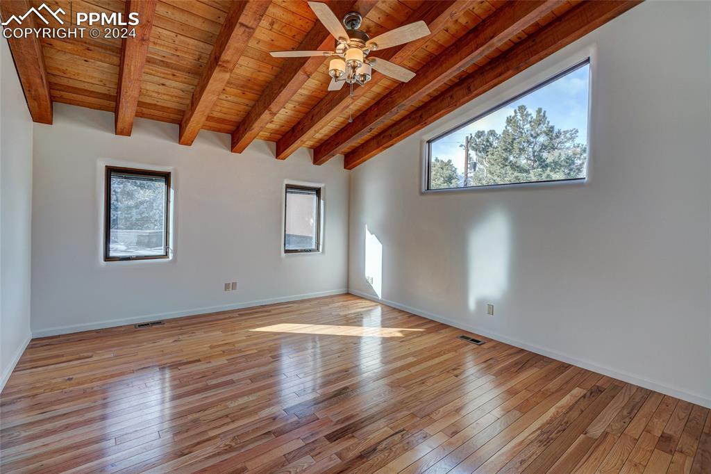 15 4th Street Colorado Springs, CO 80906 - Photo 43 of 46 a view of an empty room with wooden floor and a window