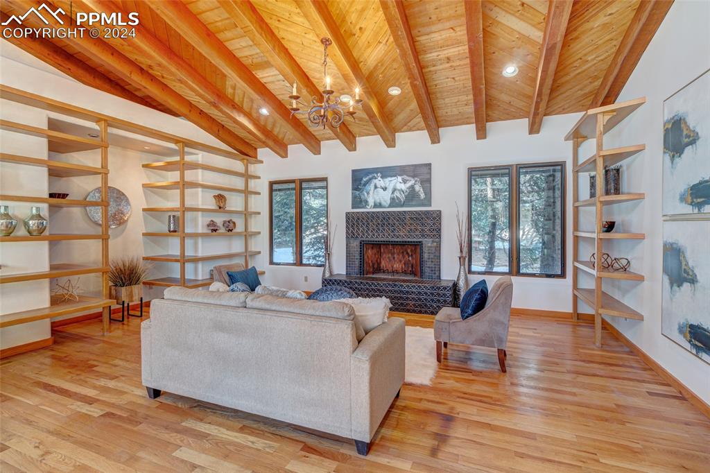 15 4th Street Colorado Springs, CO 80906 - Photo 7 of 46 a living room with furniture a fireplace and a large window