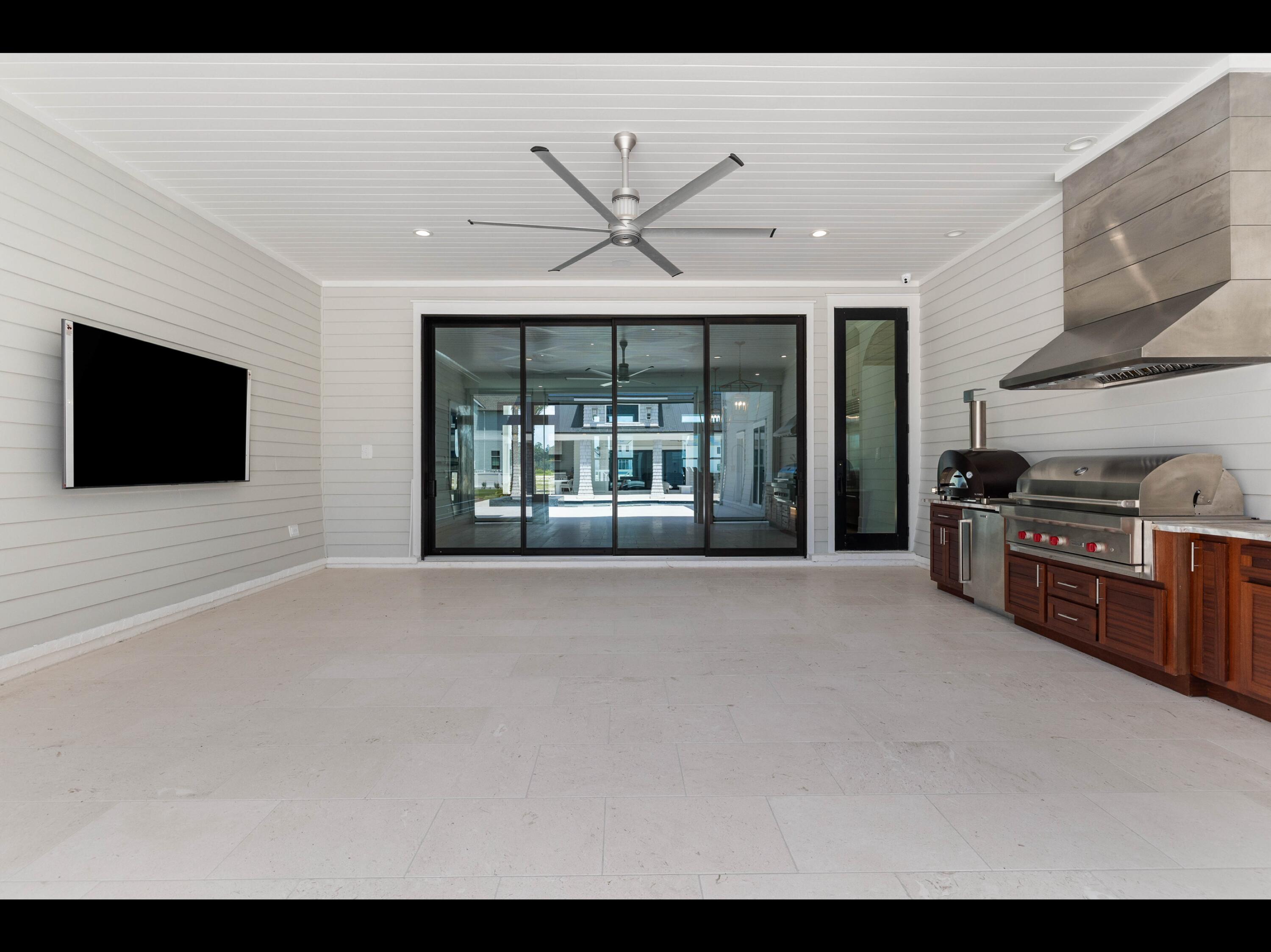 19 Quail Hollow Inlet Beach, FL 32461 - Photo 34 of 84 a living room with stainless steel appliances kitchen island furniture and a flat screen tv