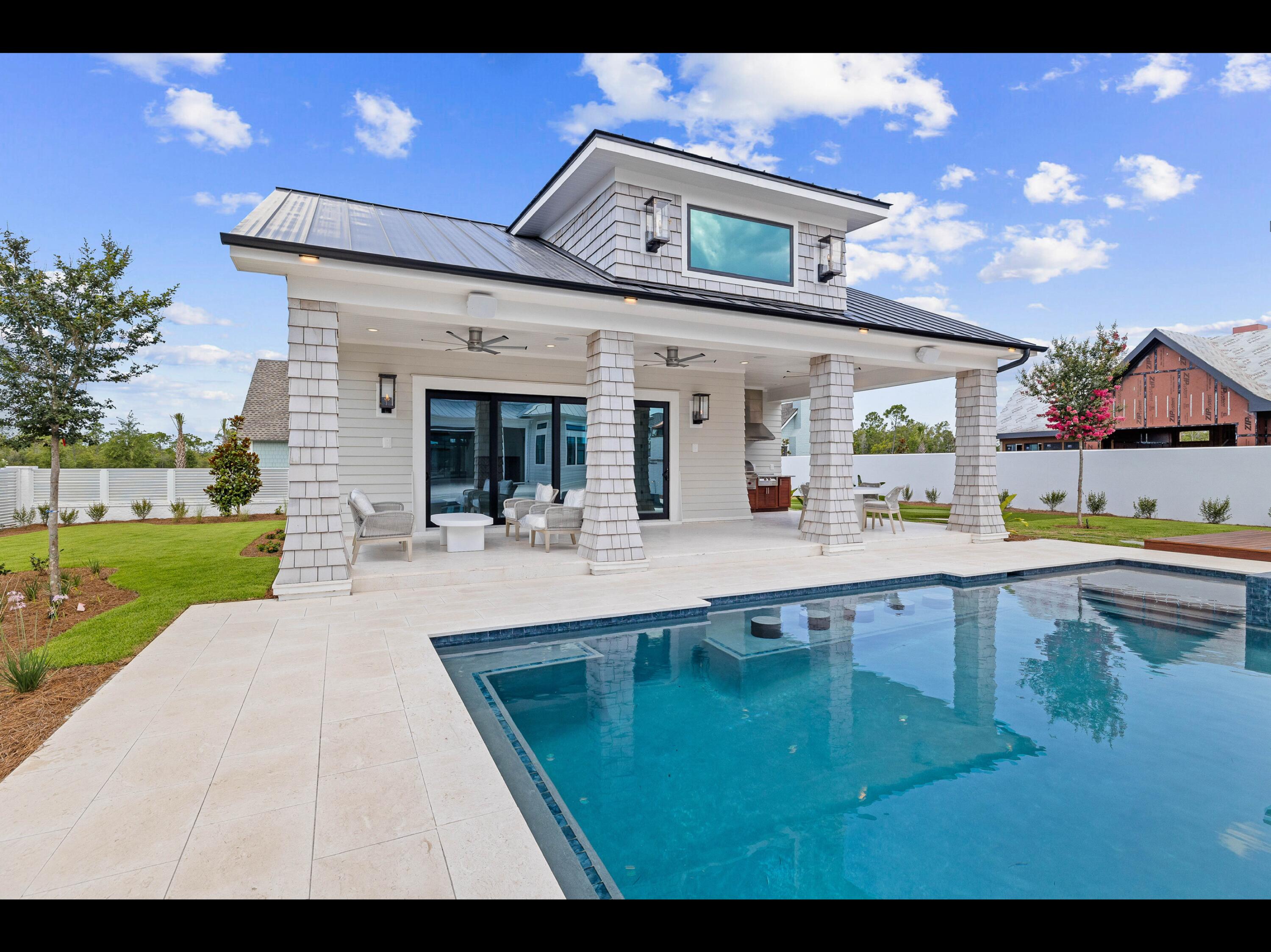 19 Quail Hollow Inlet Beach, FL 32461 - Photo 39 of 84 a view of a house with swimming pool and yard with furniture