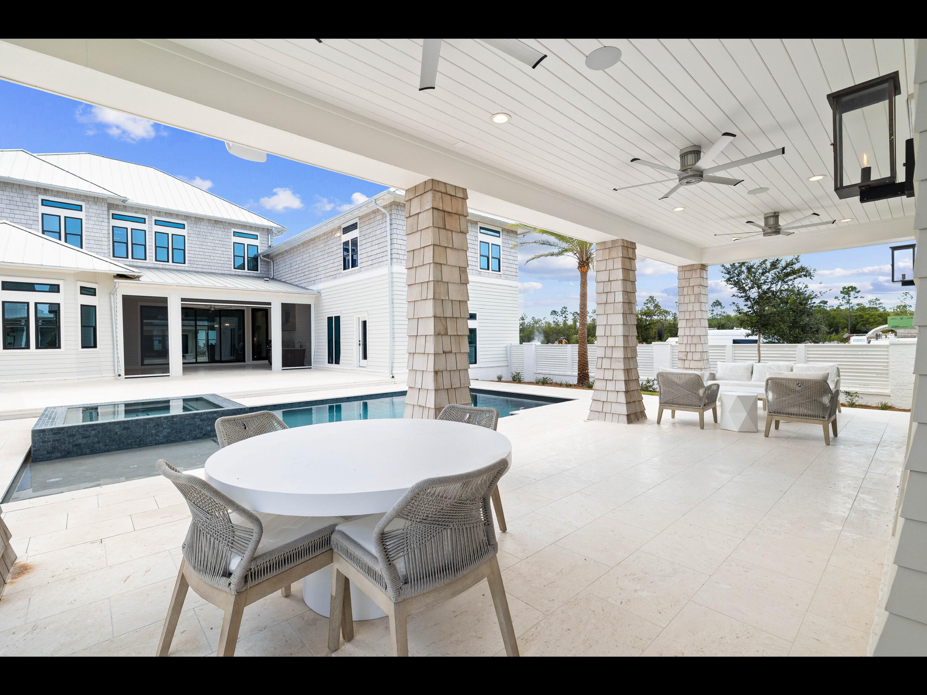 19 Quail Hollow Inlet Beach, FL 32461 - Photo 40 of 84 a view of a dining room with furniture and a floor to ceiling window