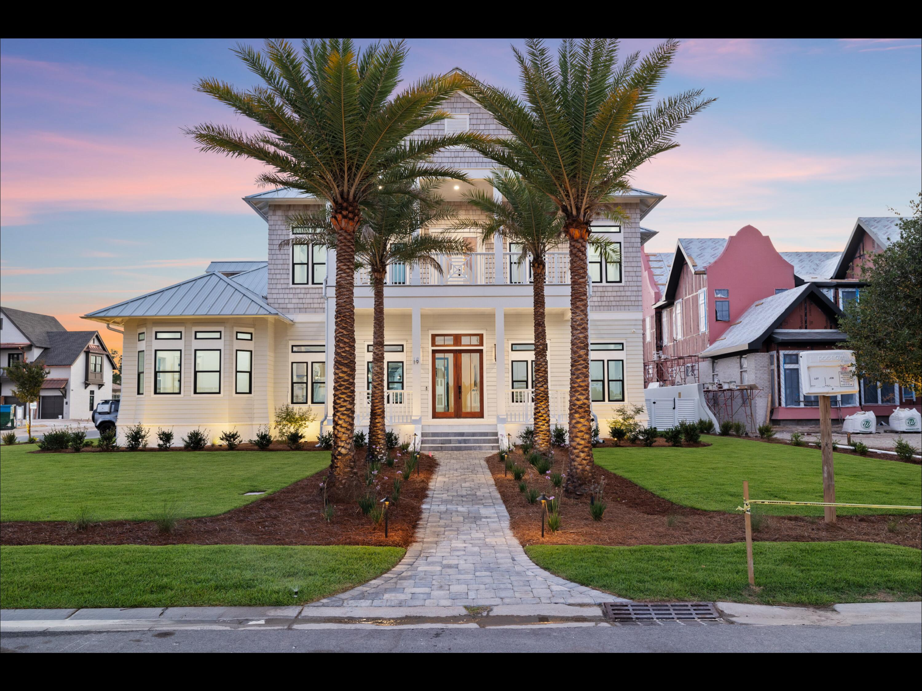 19 Quail Hollow Inlet Beach, FL 32461 - Photo 4 of 84 a view of a yard in front of a brick house with large windows