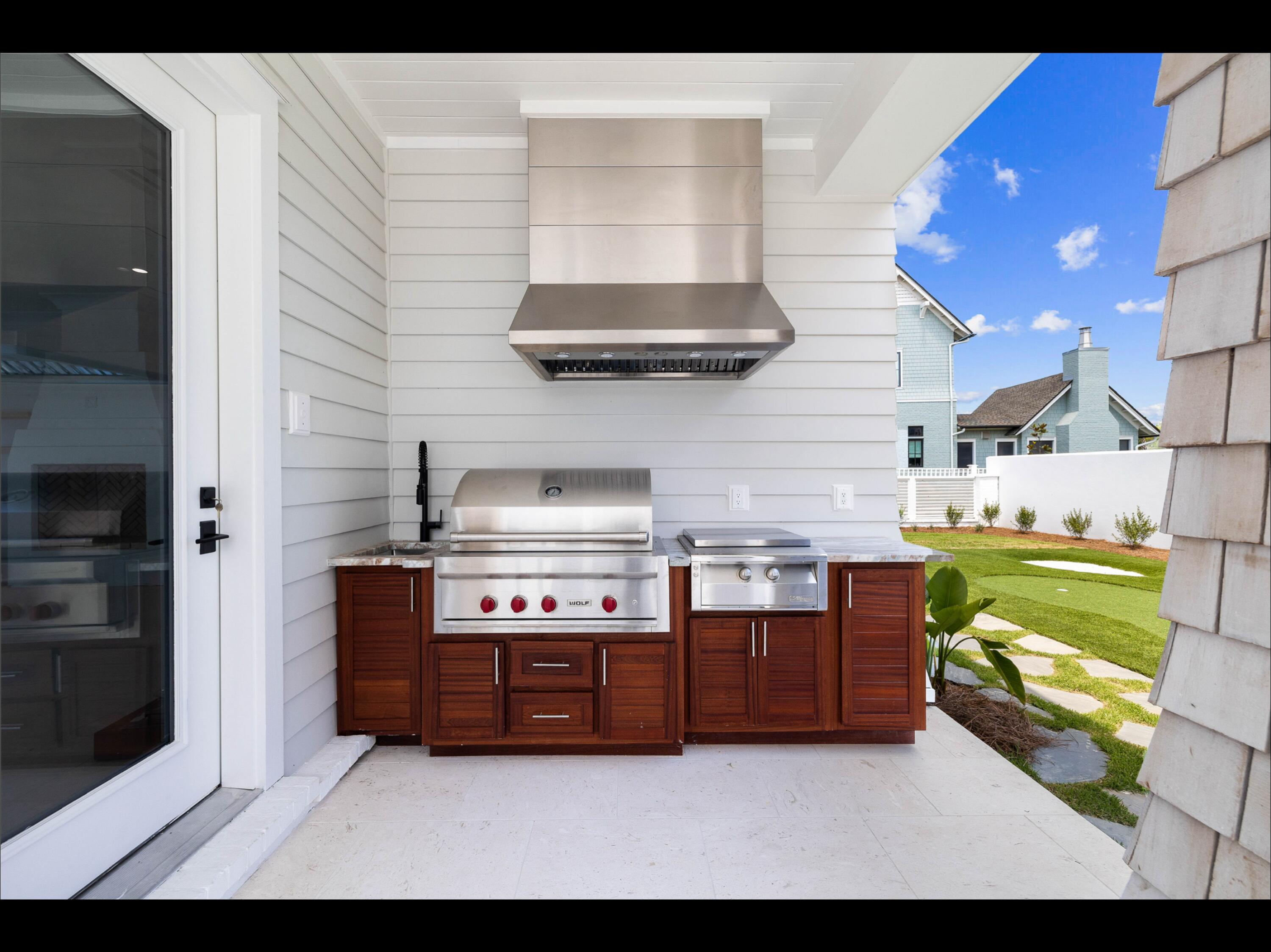 19 Quail Hollow Inlet Beach, FL 32461 - Photo 42 of 84 a kitchen with stainless steel appliances a stove and a refrigerator