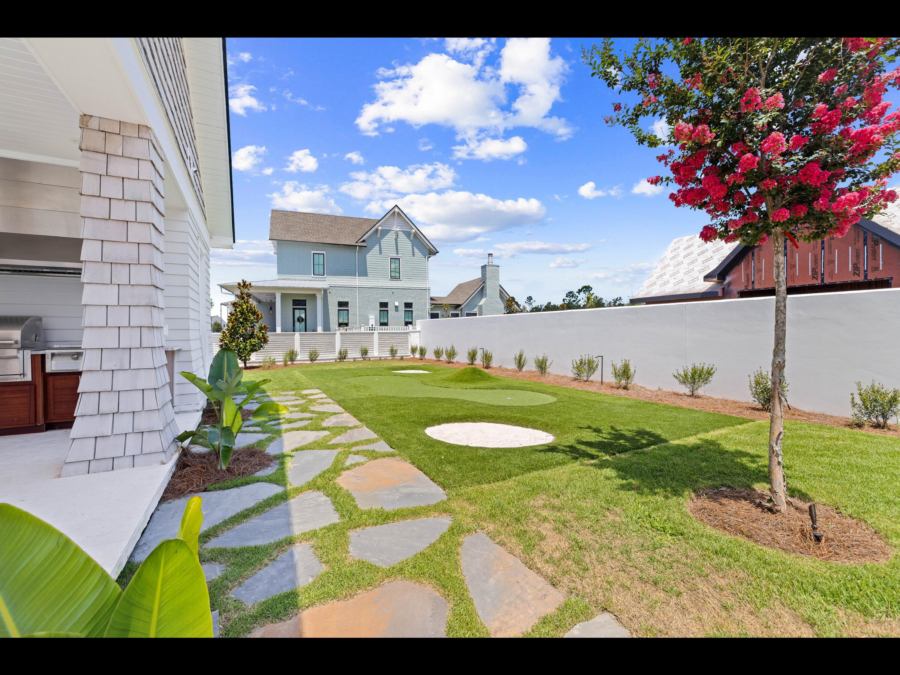 19 Quail Hollow Inlet Beach, FL 32461 - Photo 43 of 84 a view of a garden with a building in the background